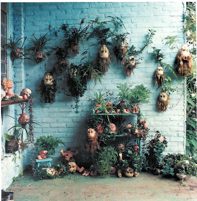 installation with dolls and plants