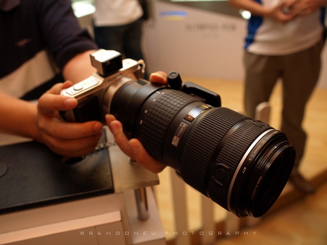 The Olympus 35-100mm lens costs almost twice as much and weighs three times as much. But it is a much better lens. Is this what you want? 