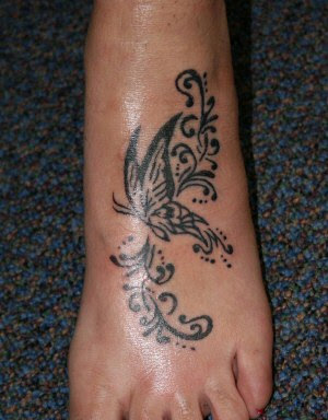 http://3.bp.blogspot.com/_jLGyBoPa6zk/TM2r9MwnDEI/AAAAAAAAAp4/_3IlP2N4rck/s400/Tribal+Butterfly+Tattoos+20.jpg