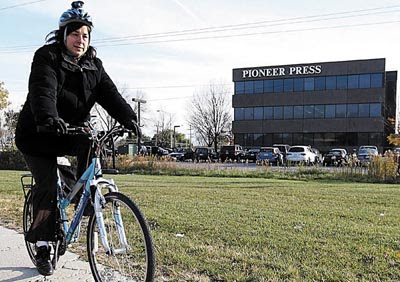 Image of columnist Ruth Solomon on her bicycle