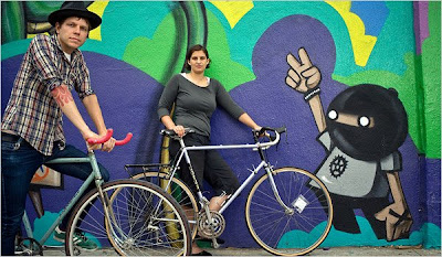 Image of older bikes in front of mural in Los Angeles