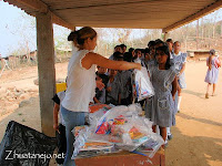 students receiving school supplies