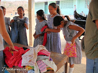 schoolgirls receiving donated clothing