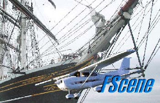 light aircraft passes in front of bow of sailing ship