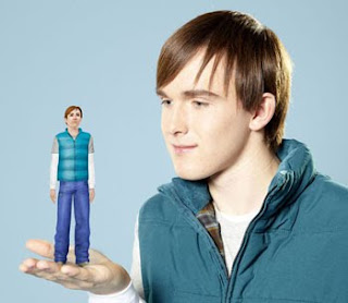Michael Perham holding his sim charater in his hand