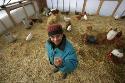 Reginaldo Haslett-Marroquin in one of his solar-heated hoop hen houses