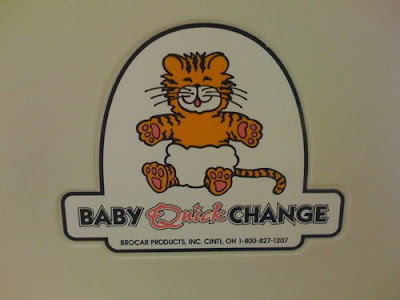 Cute orange tiger in a diaper, label says Baby Quick Change