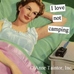 Woman reclining in bed, thinking I love not camping