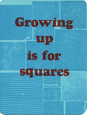 Postcard that reads Growing up is for squares in red, with blue wood-grained squares in the background