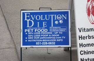 Blue sign with white letters reading EVOLUTION DIE because the final T in DIET is shared with the T in EVOLUTION, but this is not visually clear