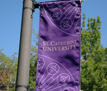 Purple University of Saint Catherine banner on a light pole
