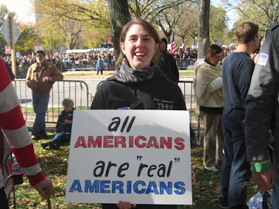 All Americans are REAL Americans, black, red and blue marker on white poster board