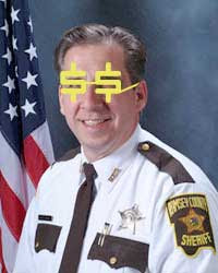 Sheriff Bob Fletcher Photoshopped to wear yellow dollar sign glasses