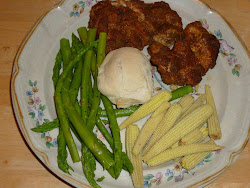 Crumb-Coated Chicken Thighs served with asparagus and baby corn