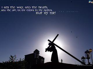 I am the way, and the truth and the life, no one comes to the father, but by me Jesus carrying cross with blue background sky photo