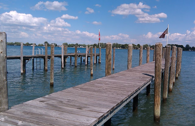 View of St. Clair River docks and the Canadian shoreline from AJ's Salt Docks in Algonac, Michigan