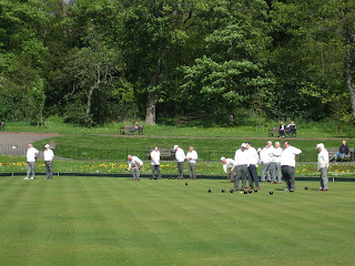 people playing Bowls in Heaton Park on a sunny day