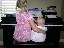 Olivia teaching piano to Chloe