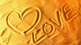 Heart Shape and Love Text on Sand HD Valentines Day Wallpaper