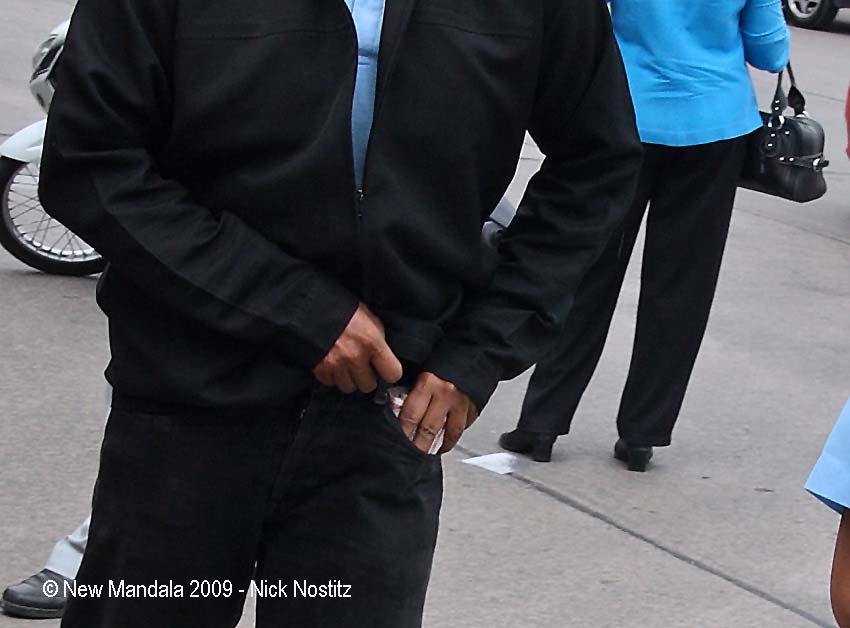 [11-money-into-pocket-close-up.jpg]