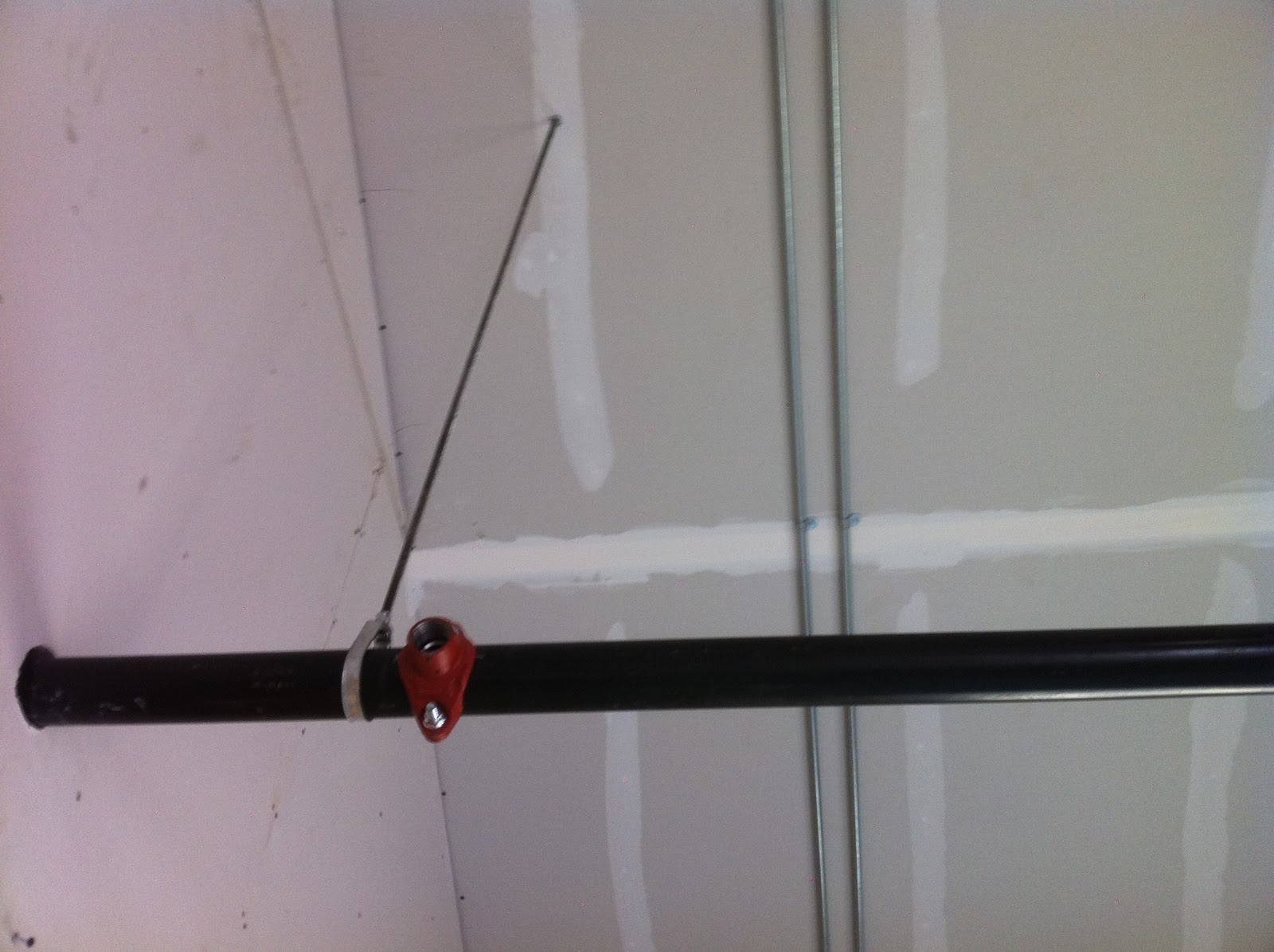 Charlestown LDS Spreading topsoil, hanging sprinkler pipe and asphalt