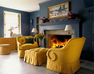 living-room_traditional-tufted-chair-ottoman-mustard-yellow-peacock-blue-gold_jeffrey-billhuber-house-beautiful.jpg