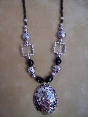 Black and silver necklace with flowers