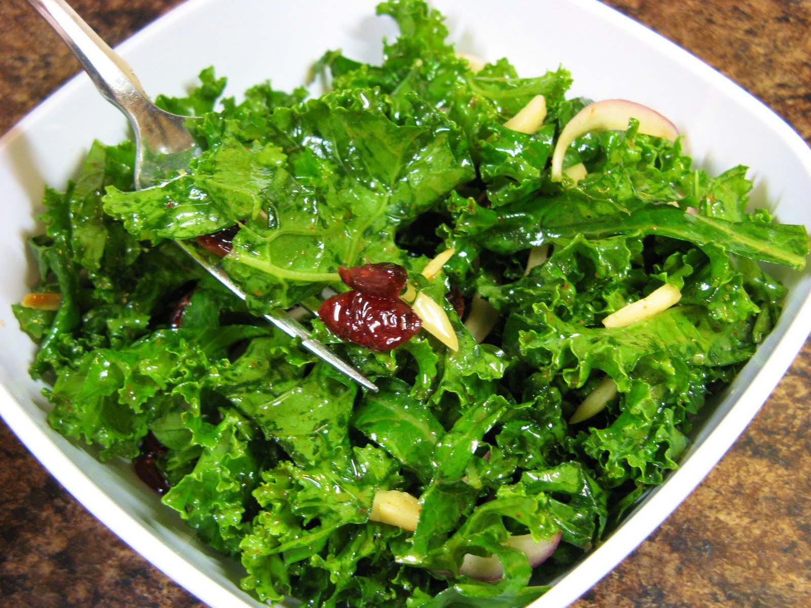 The WellFed Newlyweds Raw Kale Salad with Almonds and Cranberries
