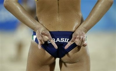 Brazil's Larissa França signals during a women's beach volleyball game
