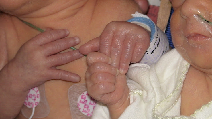 The girls, holding hands, first time they met