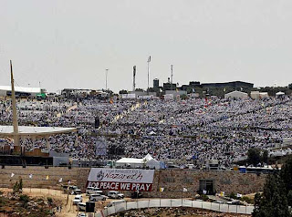 The crowded people of mass celebrating the event of Pope Benedict XVI at Mount Precipice in the northern Israeli city of Nazareth photo
