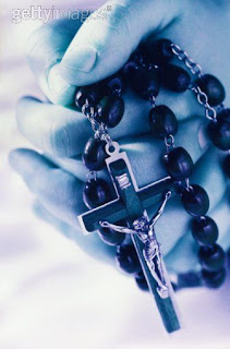 Christian Cross with Holy Black rosary beads and small Jesus Christ crucifixion religious Christian image