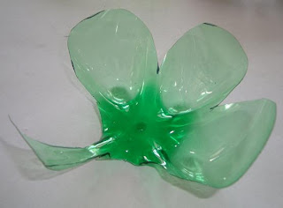 Cutout 2-liter bottle bottom cut-out into shamrock shape 