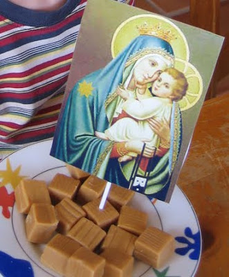 Caramels on a plate with a picture of Our Lady of Mt. Carmel