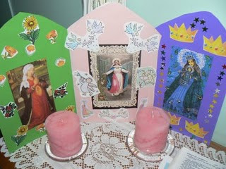 Cardboard painted green, pink, and purple made into a triptych with pictures of Mary