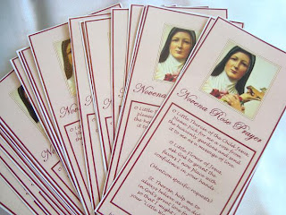 Prayer cards with pictures of St. Therese and prayers