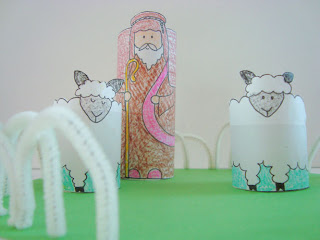 Shepherd and sheep standees in craft pasture