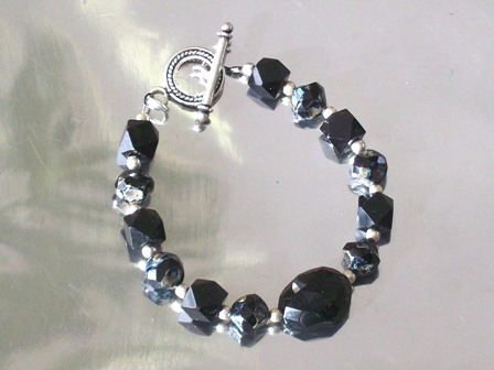 Jet black centerpiece, unusual black glass bead bracelet - $24