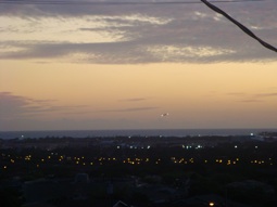 There's a distant airplane in the picture