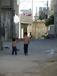 Children holding hands in Aida refugee camp