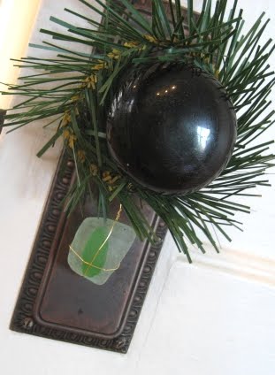 mini Christmas wreath around door knob