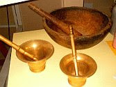 a color photograph of brass and wooden dornillos, aka mortars and pestles