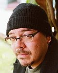 A color photo of Greg Rucka.