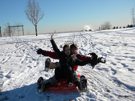 Brittany and Korey having fun sledding..