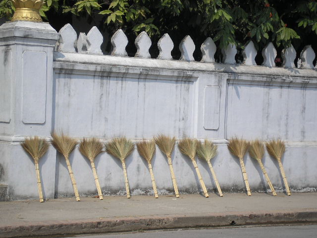 [brooms+at+the+entrance+of+temple.jpg]
