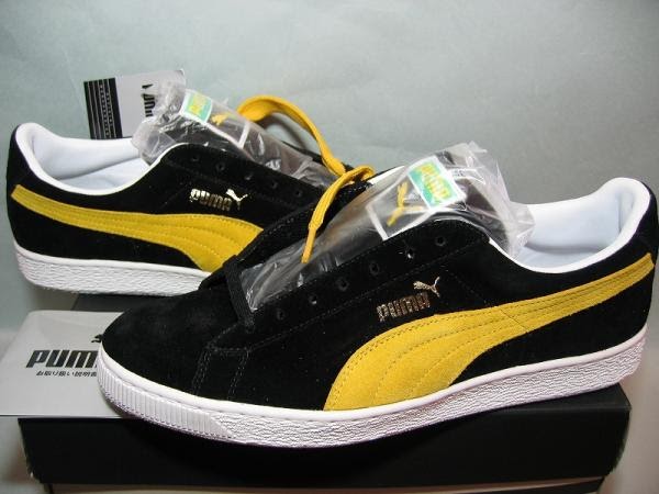 black and yellow puma suede