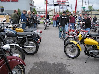 Folks gather around classic bikes at Brookside Motorcycle Company.