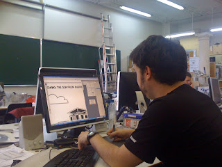 A team member working on the comic strips
