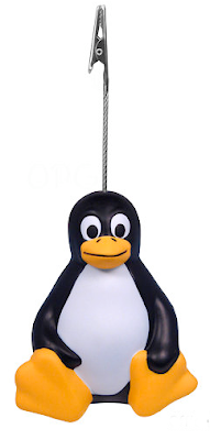 memo holder with single alligator clip; base is a seated penguin