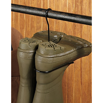 boot hanger with boots hanging upside down on a closet rod